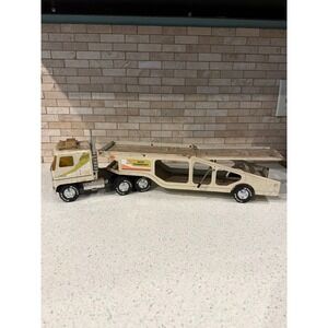 vintage Nylint pressed-steel GMC Astro 95 car transporter. A‎ nice Hauler